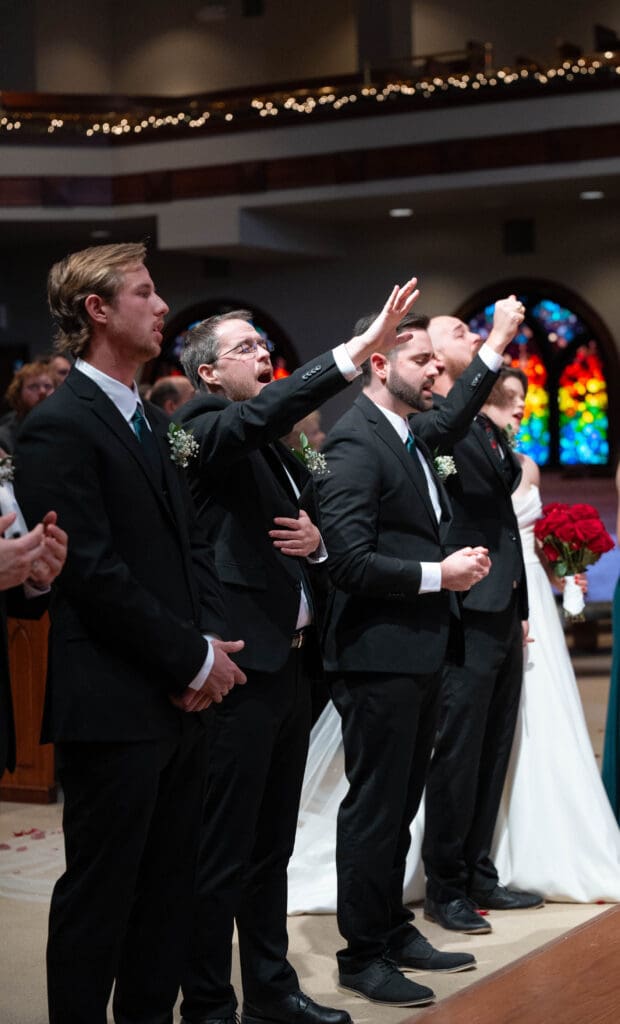 bridal party worshipping during wedding ceremony