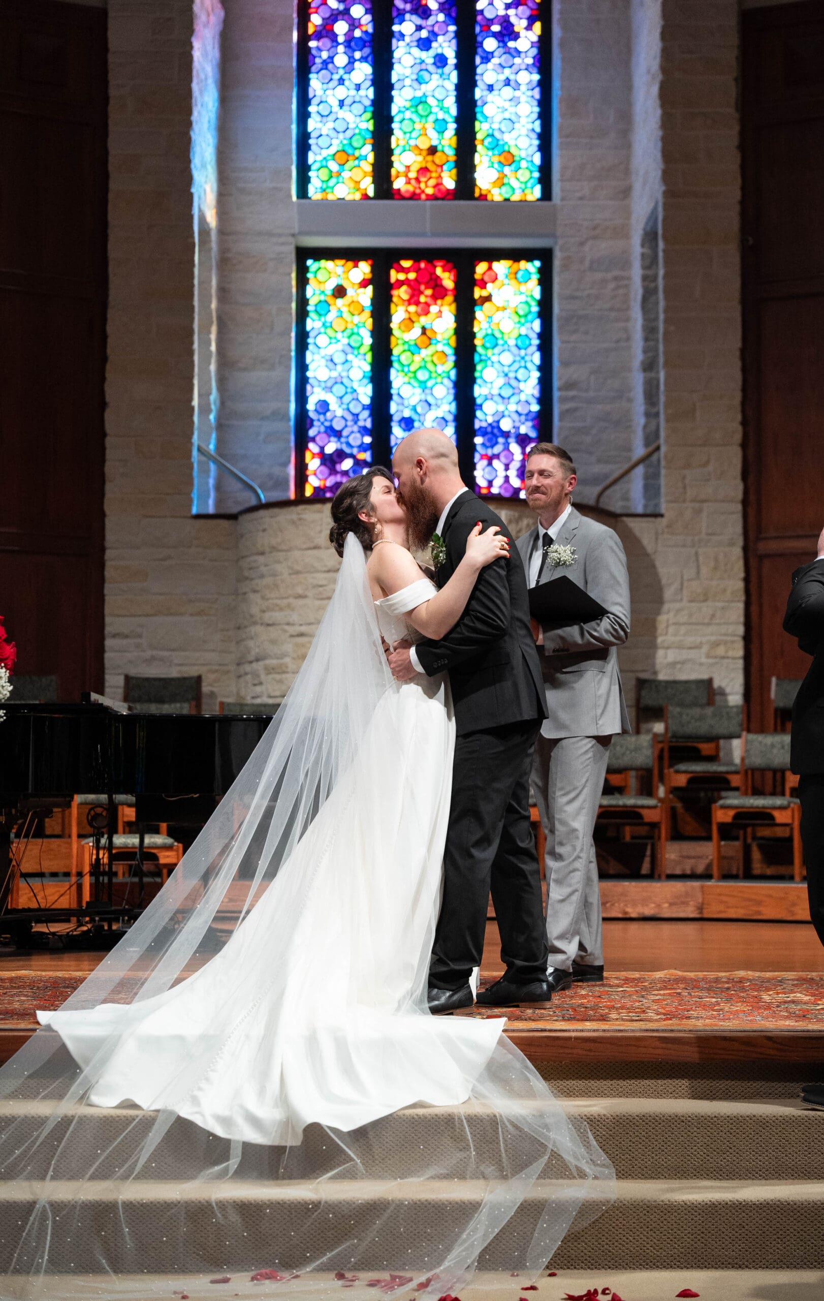 bride and groom share their first kiss as husband and wife