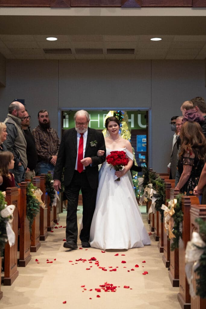 bride walking down aisle in church