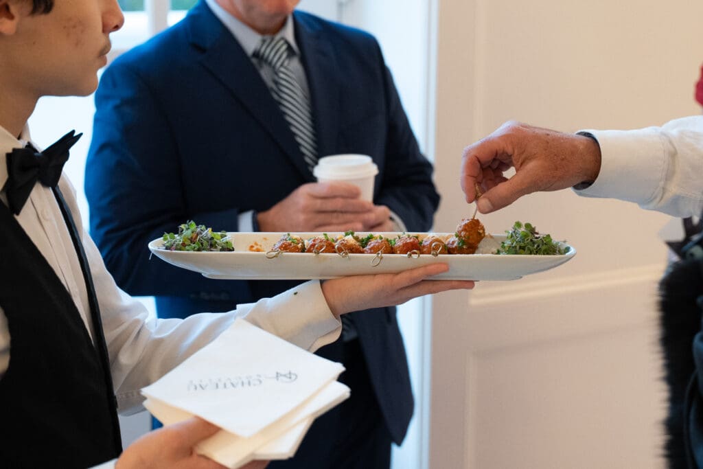 Guests eat at Cocktail hour at Chateau Nouvelle wedding