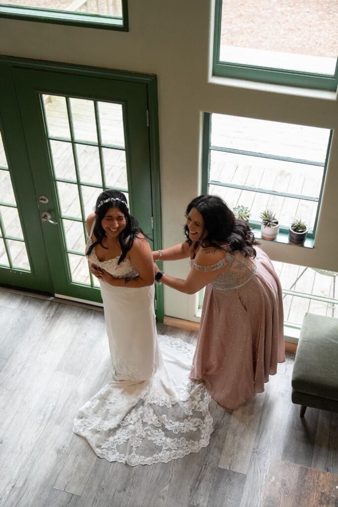 bride getting ready with her mom during an intimate Houston wedding